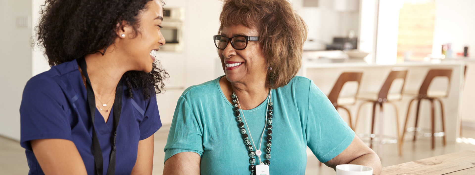 caregiver and senior smiling