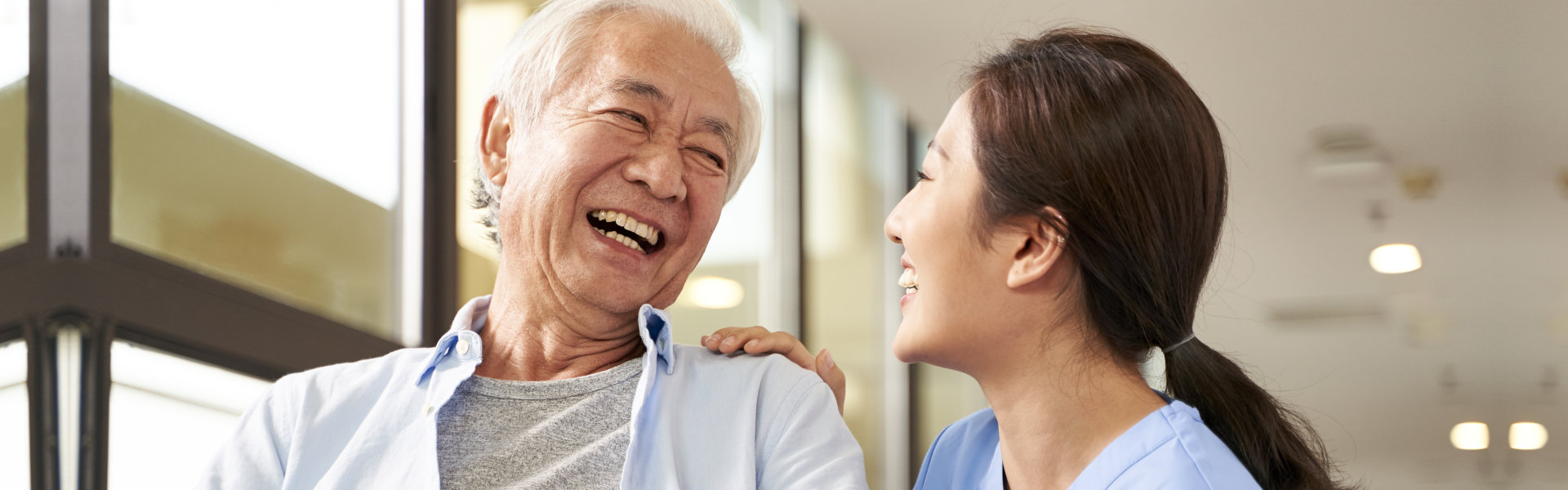 caregiver and senior smiling