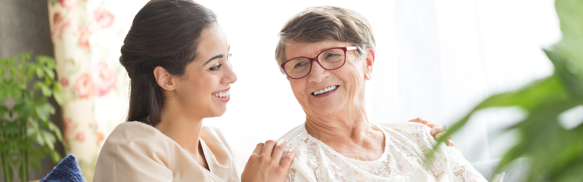 caregiver and senior smilling